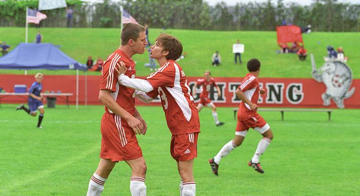 Mob=vie still from She's the Man with Amanda Bynes and Channing Tatum who wear red soccer uniforms and are on the field at UBC Thunderbird Stadium