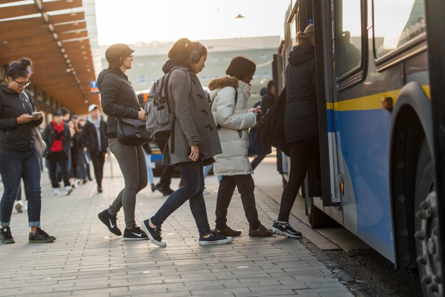 People boarding a bus