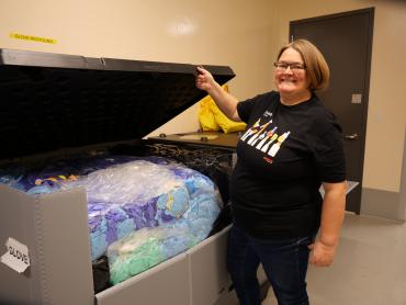 Dr. Kappelhoff shows off their lab's glove recycling program. 