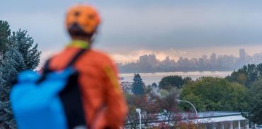 Cyclist looking at view of the city